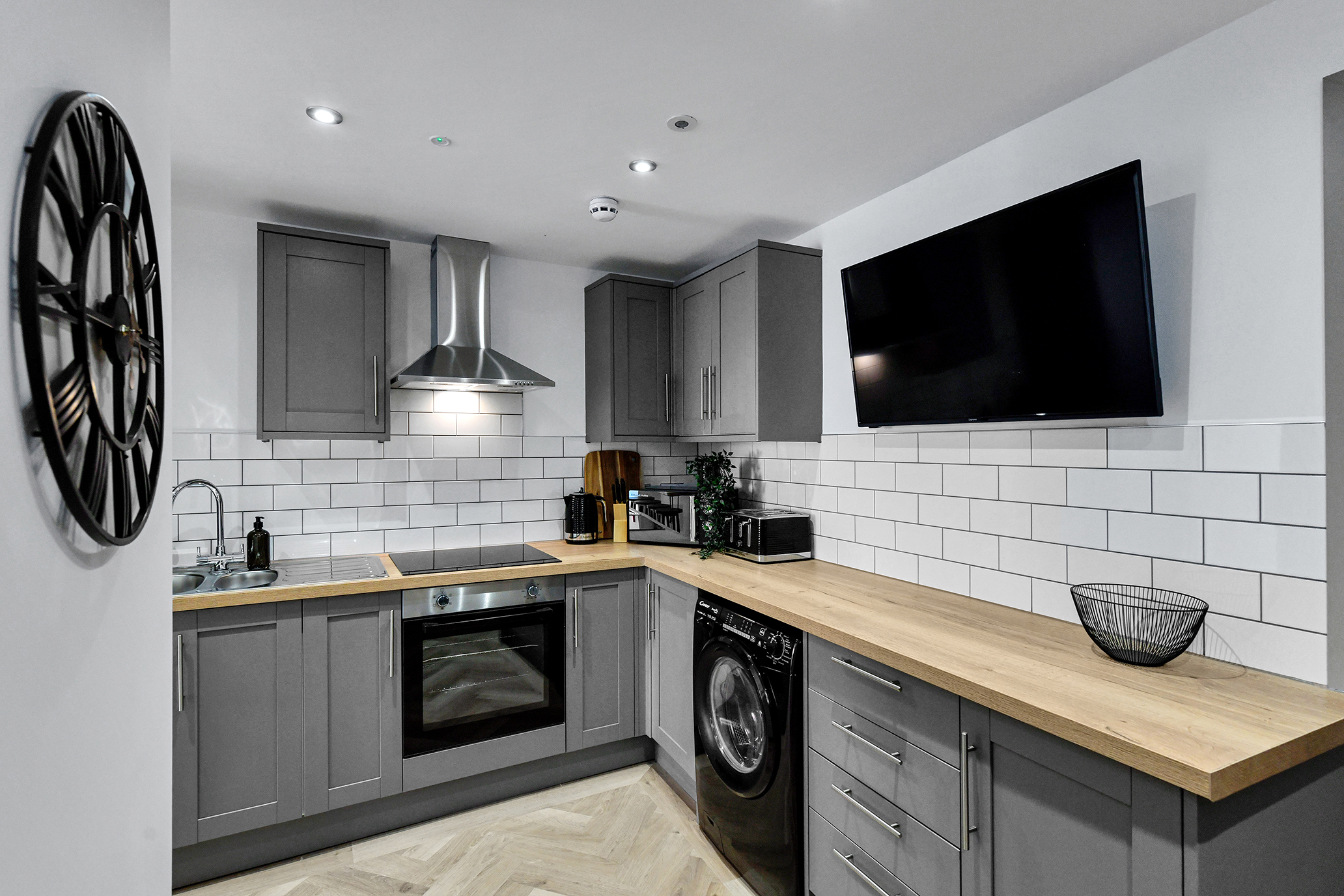 Grey kitchen with oak worktops at 64 Derbyshire Lane