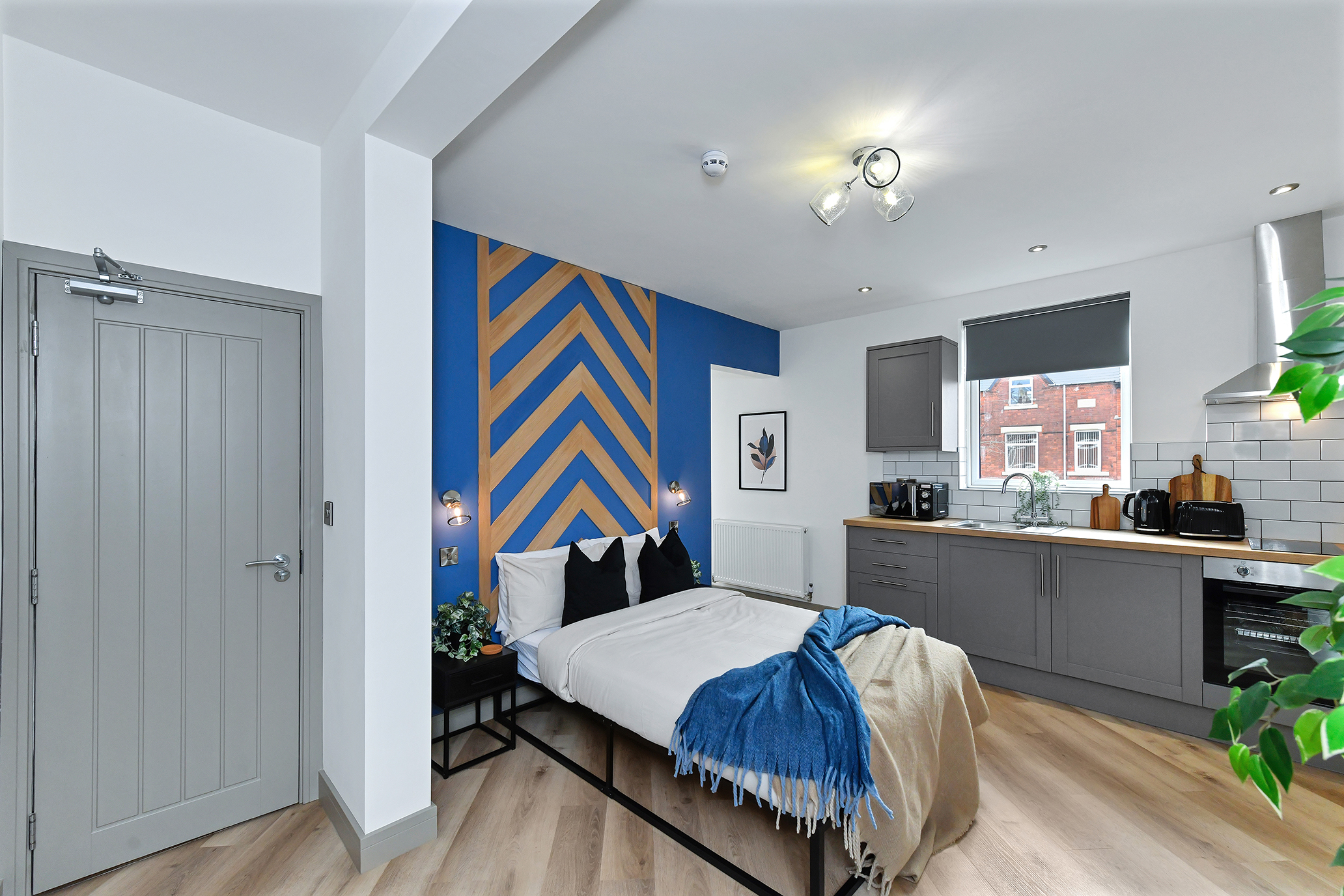 Bedroom and kitchenette at 64 Derbyshire Lane